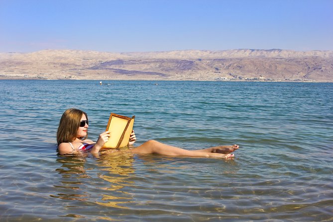 Day Tour Bethany Baptism Jordan River Site & Dead Sea from Amman - Floating at the Dead Sea